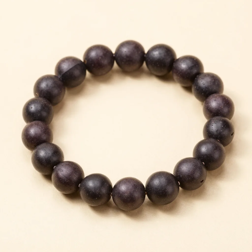 A natural açaí seed bracelet on a light background