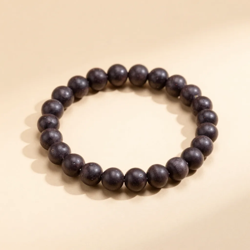 An açaí seed bracelet set on a light background